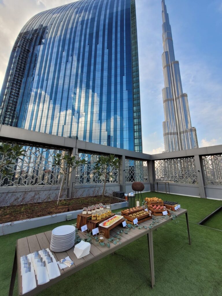 Luxury private catering setup with Dubai skyline and Burj Khalifa